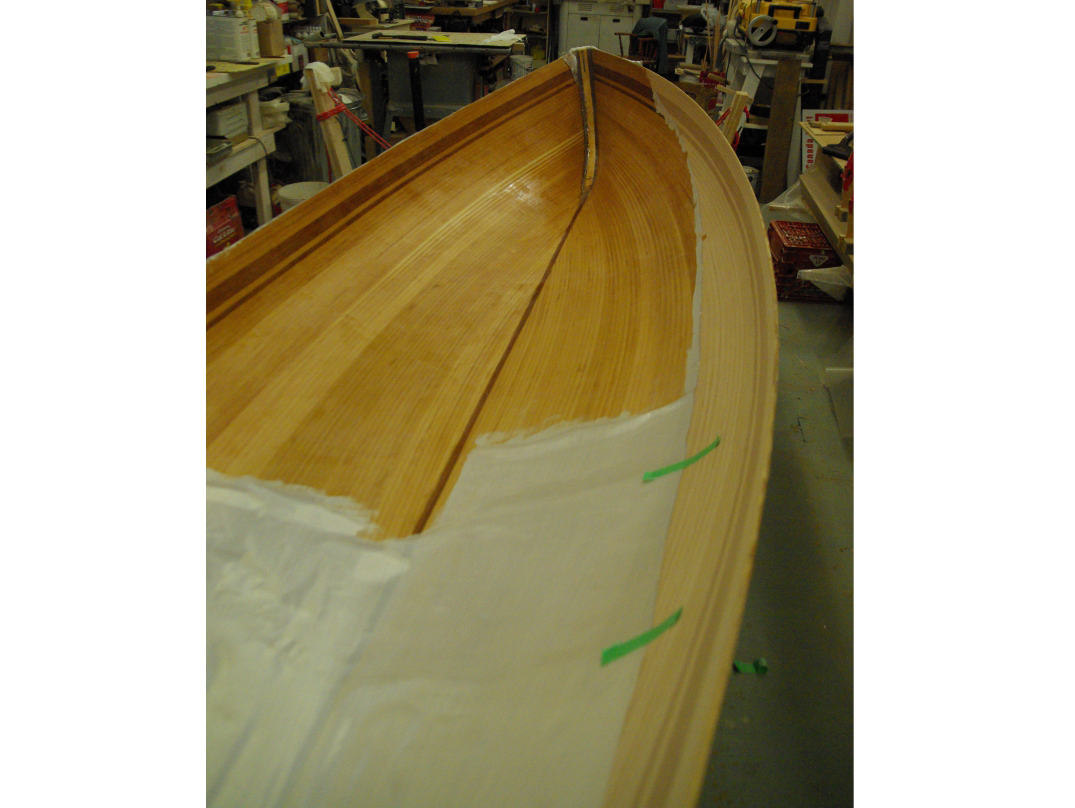 Internal hull of boat, with fibreglass application in progress